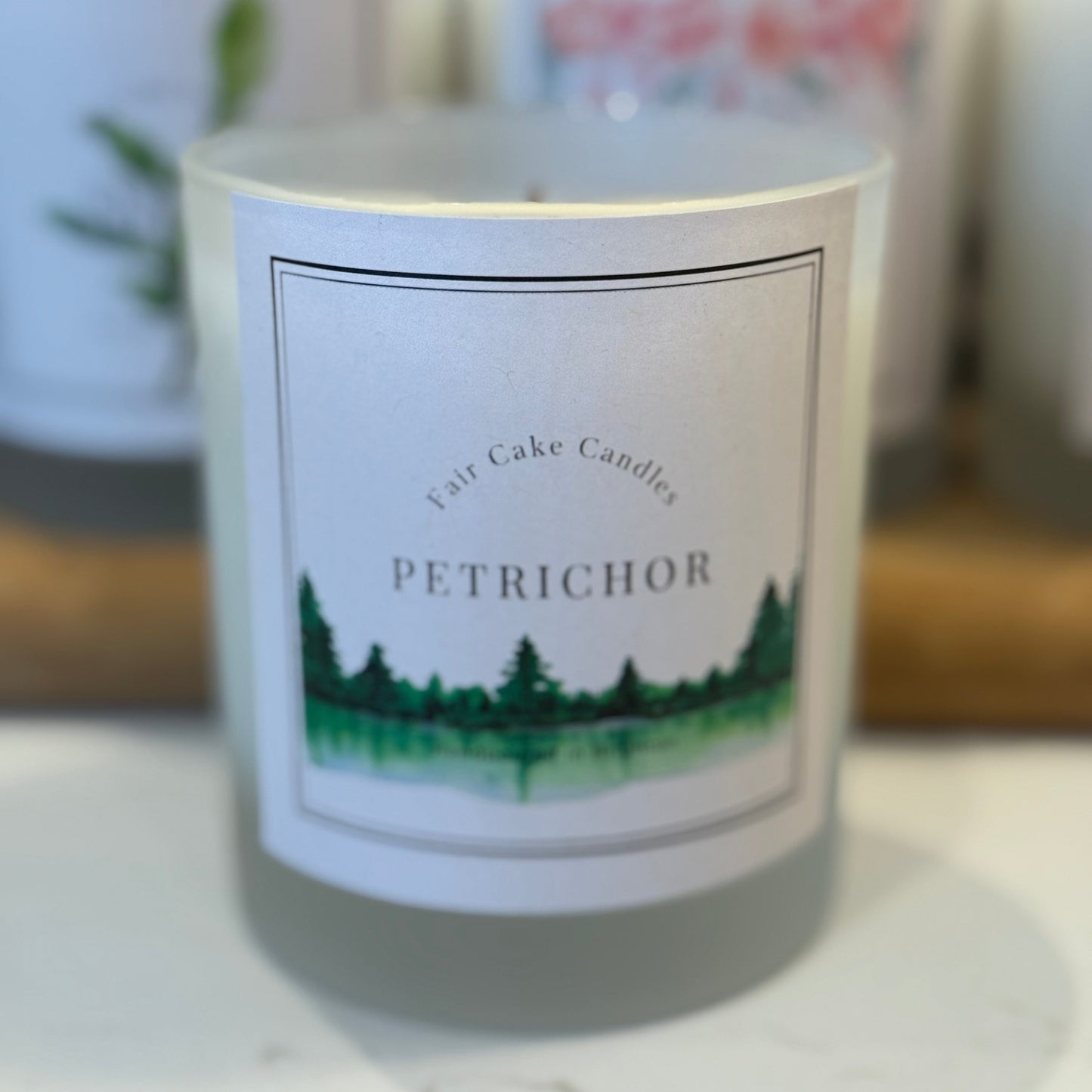 Petrichor scented fresh rain candle by Fair Cake Candles. Hand poured, soy wax natural candles.