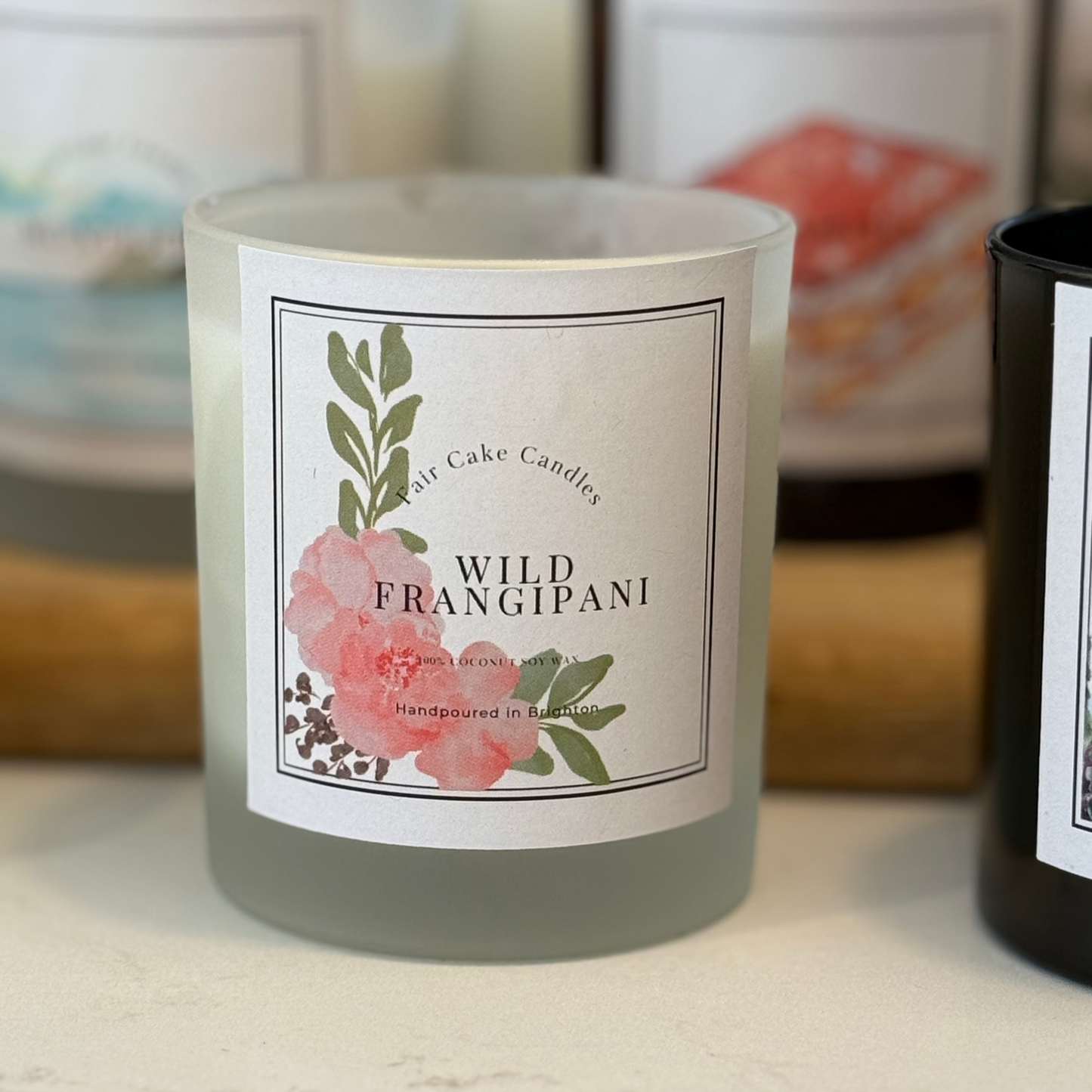 Hand poured Wild Frangipani scented candle by Fair Cake Candles